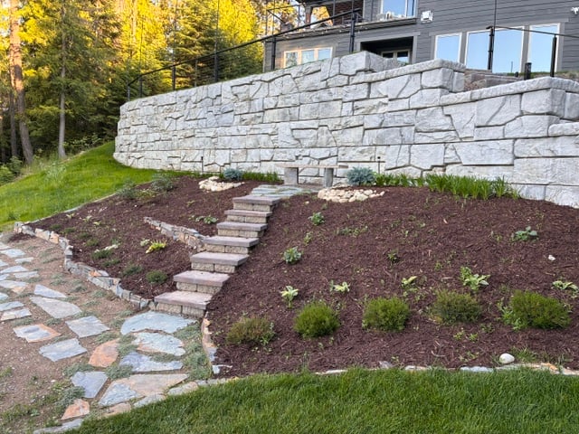 Finished landscaping with flagstone path and planting beds
